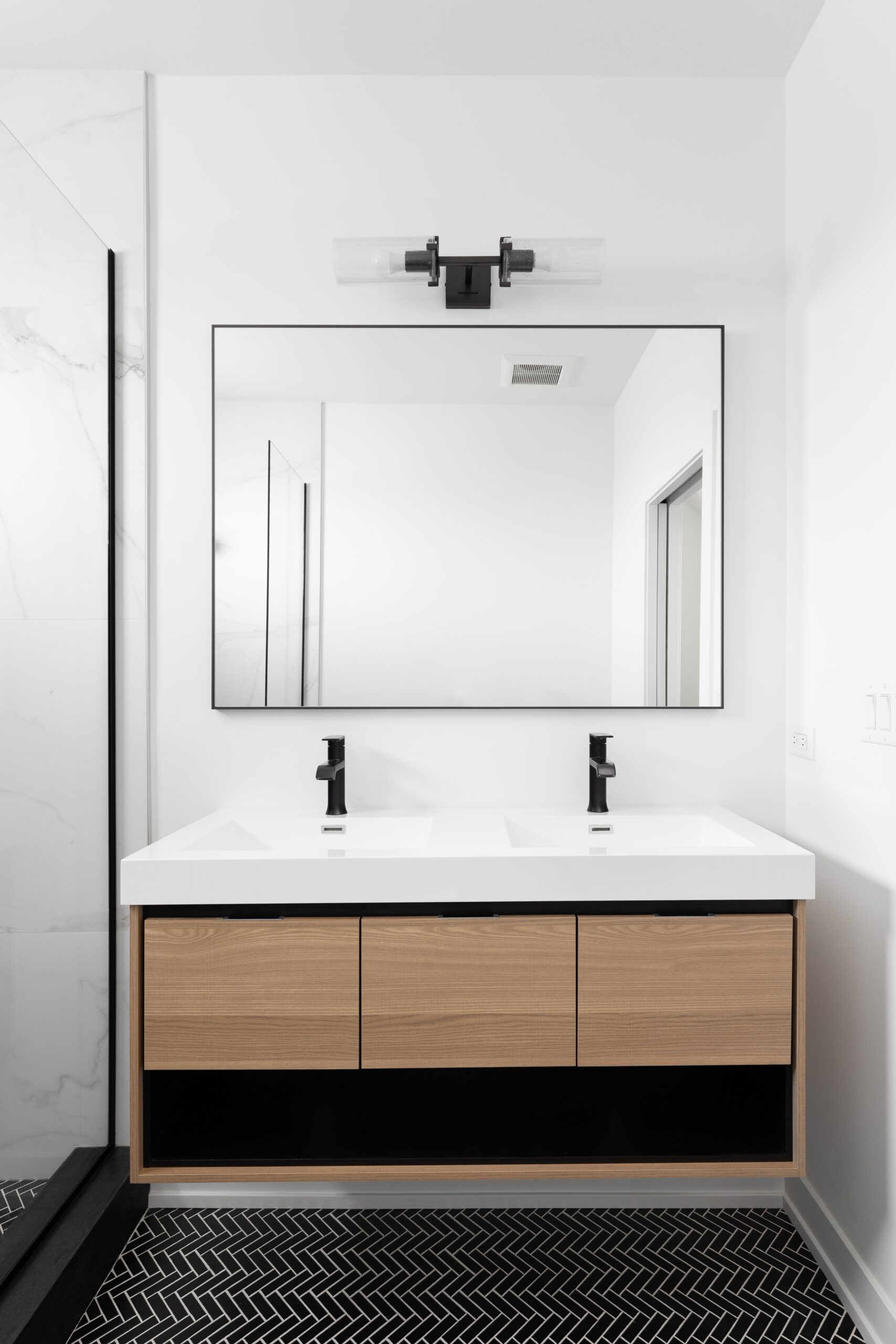 A,Modern,Bathroom,With,A,Floating,Wood,Cabinet,,Black,Marble