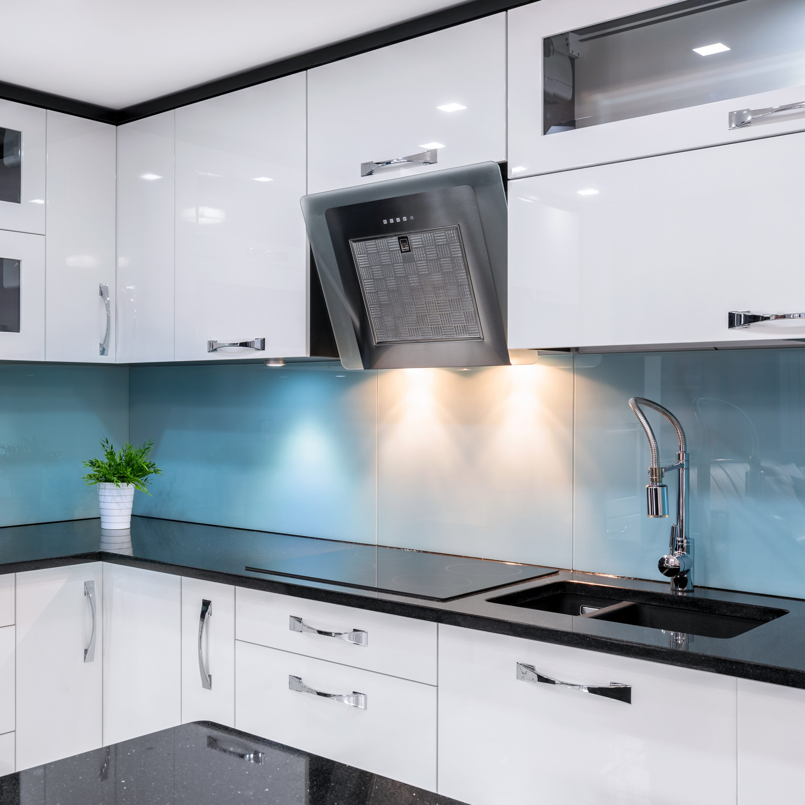 Modern,Kitchen,With,White,Furniture,And,Black,Worktop