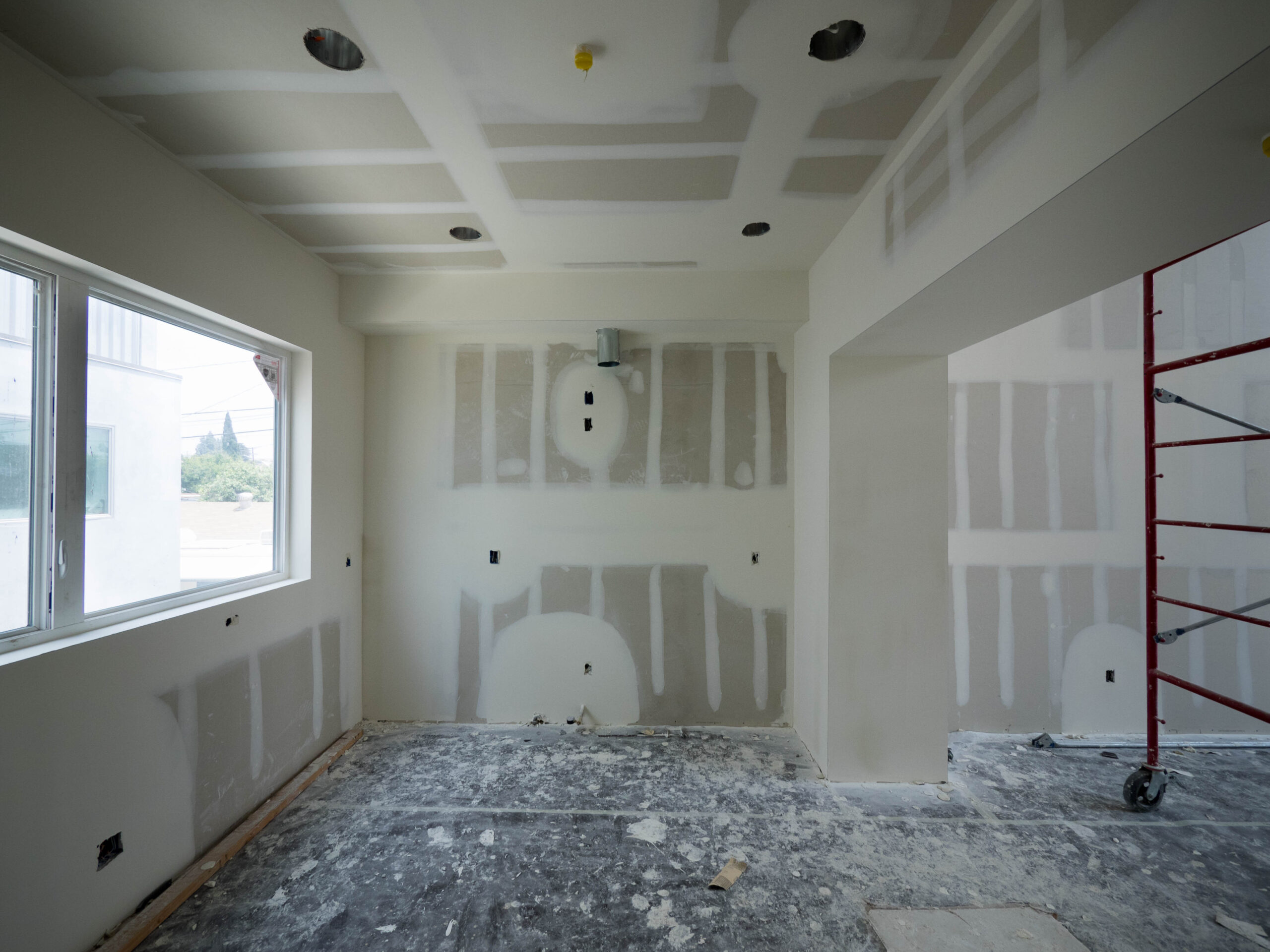 Interior,Construction,Of,Housing,Project,With,Drywall,Installed,And,Patched